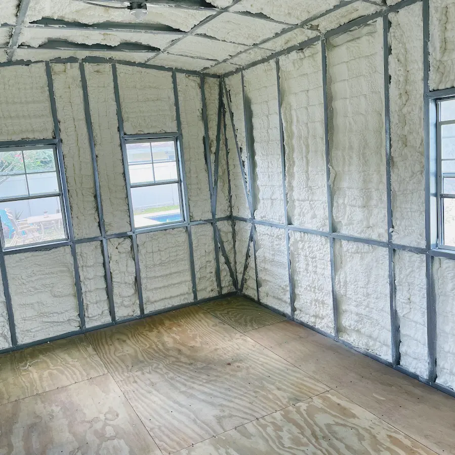 Closed-cell spray foam insulation applied to wall cavities in a residential project in Hughson